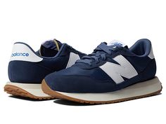 New Balance Classics 237v1 - Men's Shoes : Natural Indigo/Vintage Indigo : Add a vintage runner design to your wardrobe with the iconic silhouette of the New Balance Classics 237v1 sneakers. Casual fashion shoe in a sporty silhouette. Textile and synthetic upper with lace-up closure. Foam-padded collar and tongue. Breathable textile lining with removable insole. Synthetic rubber outsole for added traction. Imported. Measurements: Weight: 12 oz Product measurements were taken using size 9, width Sportswear Sneakers With Cushioned Footbed And Round Toe, High-top Cushioned Sneakers For Sportswear, Sportswear Sneakers With Cushioned Footbed, Casual Nylon Running Shoes With Cushioned Footbed, Nylon High-top Sneakers In Athleisure Style, Nylon High-top Sneakers For Athleisure, Casual Running Sneakers With Rubber Waffle Outsoles, High-top Nylon Sneakers In Athleisure Style, Comfortable Sneakers With Rubber Waffle Outsoles For Running