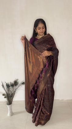 Timeless silk and design saree, Embrace the richness of the Windsor wine saree, beautifully adorned with floral wines and intricate weaves patterned borders. It takes longer on the handloom as it has a human involvement to have a fine designs, which make fabric rich and luxurious. Color: Wine Fabric: Pure Brocade silk Design Type: Kanjivaram silk saree Items Included: Saree | Unstitched blouse Wash Care: Dry Clean Only Disclaimer Text: Product color may slightly vary due to photographic lighting Luxury Brocade Fabric For Saree, Brocade Pre-draped Saree For Diwali Puja, Festive Brocade Pre-draped Saree For Diwali, Semi-stitched Brocade Pre-draped Saree For Diwali, Self Design Brocade Saree, Unstitched Brocade Saree With Self Design, Festive Brocade Saree With Self Design, Brocade Saree With Self Design For Puja, Brocade Saree For Puja