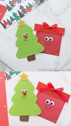 two christmas trees made out of construction paper with eyes and nose on them, sitting next to each other