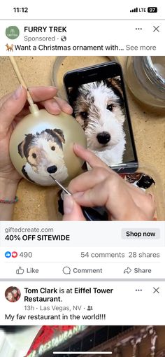 someone is holding a christmas ornament with two dogs on it and the other one has