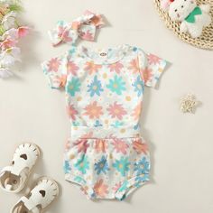 This adorable baby girl outfit features vibrant floral prints and comes with a matching romper shorts and headband. Perfect for playdates, picnics, or any outdoor adventure. Your little one will stay stylish and comfortable all season long! Spring Floral Print Cotton Bubble Romper, Summer Bubble Romper For Playtime In Spring, Spring Playful Printed Bubble Romper, Playful Short Sleeve Bubble Romper For Spring, Cute Summer Floral Print Bubble Romper, Cute Bubble Romper For Playtime In Spring, Cute Bubble Romper For Spring Playtime, Cute Spring Bubble Romper For Playtime, Playful Floral Print Bubble Romper For Spring