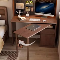 a computer desk with a laptop on top of it next to a bed in a bedroom