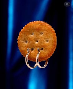 two silver rings are attached to a cracker