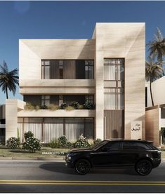 a black suv is parked in front of an apartment building with palm trees on both sides