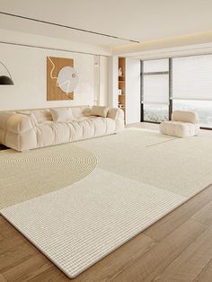 a large living room with white furniture and wood flooring, along with an area rug on the floor