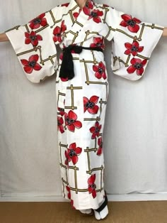 "A cute vintage Yukata Kimono dress from Japan.  Made of light cotton for warm summer days.  Wear this as a dress, robe, beach cover or dressing gown.  Sash sold separately. Fits a women's size S. MATERIAL:  100% Cotton.  Unlined. PATTERN:  Oversized flowers and lattice. Color:  White with black, red & yellow design. CONDITION:  Used vintage.  A few light stains (see photos). Sash NOT included. Kimono sash sold separately. My shop: https://kimonomemoirs.etsy.com. SIZE: Women's SMALL Kimono. (Model is 5'7\" wearing 1.5\" platform sandal) Wingspan- 49 inch (124.5 cm) across the top, sleeve end to sleeve end. Length- 57.5 inch (146 cm) from neckline to bottom of robe. Sleeve length- 17.5 inch (45 cm) from top to bottom of sleeve. Width- 22 inch (56 cm) measured arm-pit to arm-pit across the b Traditional White Printed Kimono, White Long Vintage Kimono, Long White Vintage Kimono, Traditional Fitted Beach Kimono, Vintage Fitted Kimono With Kimono Sleeves, Fitted Long Printed Kimono, White Yukata, Yukata Women, Oversized Flowers