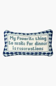 a blue and white pillow that says, my favorite thing to make for dinner is reservations