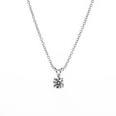 There's something classic and luxurious about a high quality single diamond hanging around your neck. This diamond solitaire pendant necklace is made from solid platinum and measures 18" long. The diamond is GIA certified as an all-natural .92ct G/VS2 round brilliant cut diamond securely set in a four prong basket style setting. This necklace comes with the GIA certificate and a free official appraisal showing the value of the necklace at $9650. Classic Solitaire Diamond White Necklace, Sterling Silver Solitaire Necklace For Formal Occasions, Classic White Gold Solitaire Necklace With Lab Grown Diamond, Classic Platinum Solitaire Necklace With Vvs Clarity, Classic White Gold Solitaire Necklace With Brilliant Cut, Classic White Gold Solitaire Necklace With Lab-grown Diamond, Classic Platinum Solitaire Necklace With Round Pendant, Diamond White Solitaire Diamond Necklace In Platinum, Classic Platinum Solitaire Necklace With Prong Setting