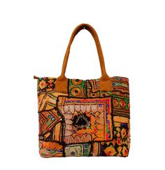 This bohemian banjara bag is the perfect accessory for the bohemian fashionistas. Key Features: Hand made in India. Fair trade guaranteed. Zipper top. Inside zipper pocket. Size ( Approx ) Height - 12 Inches/30 Cm. Width - 15 Inches/38 Cm. Handle Length 10 inches/ 25 Cm.  Inside Pocket - 3 ( As you can see in the picture ) Zipper Pocket - 1 Made from vintage Banjara  mirror work embroidery, it's a strong bag, and the perfect size for all your essential everyday stuff and more.... You'll get a lo Travel Multicolor Embroidered Hobo Tote Bag, Embroidered Brown Hobo Tote Bag, Embroidered Brown Tote Hobo Bag, Embroidered Brown Hobo Bag, Brown Bohemian Hobo Bag For Shopping, Bohemian Brown Hobo Bag For Shopping, Bohemian Satchel Hobo Bag For Shopping, Multicolor Shoulder Bag For Travel And Festival, Multicolor Shoulder Bag For Festival Travel