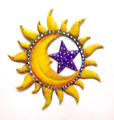 a yellow and purple sun with a star on it's side in the shape of a crescent