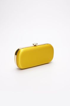 The Limoncello Yellow Bella Clutch is a bold yellow bridal handbag, crafted with duchess satin by Italian artisans featuring a lively pop of color. Planning a maximalist wedding day or looking to make a powerful statement at your next gala? Inspired by Italy’s Amalfi Coast, a coastline featuring terraced vineyards and cliffside lemon groves, this luxury handbag will make a statement on your wedding day, at a red-carpet affair, or on a tropical destination trip. First seen on celebrity stylist Mi Classic Yellow Evening Bag, Chic Yellow Rectangular Clutch, Chic Yellow Clutch For Gift, Chic Yellow Clutch As Gift, Chic Yellow Clutch As A Gift, Chic Yellow Clutch For Formal Occasions, Yellow Elegant Clutch For Formal Occasions, Elegant Yellow Clutch For Formal Occasions, Elegant Yellow Formal Clutch