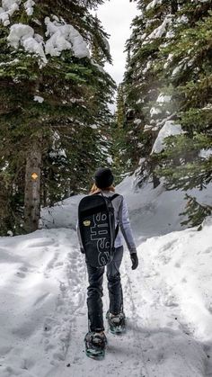 a person walking down a snow covered path