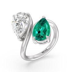 Pick this ring if you're searching for a modern minimalist engagement ring that tells a story and tells it in a simply romantic way. This toi et moi or you-and-me ring perfectly depicts the meeting of two souls. It features a slim yet curvy bypass shank, with each end topped with a pear-cut created Emerald and diamond on a three-prong basket setting. White Gold Rings With Tension Setting For Proposal, Modern Solitaire Emerald Ring, Modern Green Diamond Wedding Ring, Modern Solitaire Birthstone Ring For Anniversary, Modern Emerald Ring Vvs Clarity For Promise, Modern Emerald Ring Vvs Clarity For Wedding, Modern Emerald Promise Ring With Vvs Clarity, Modern Emerald Ring With Vvs Clarity For Wedding, Modern Green Diamond Anniversary Ring