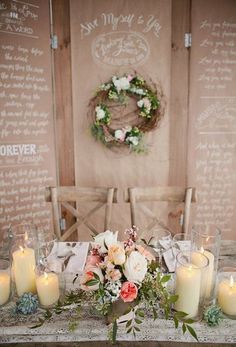 a table with candles and flowers on it