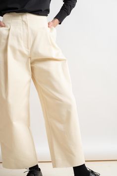 High waisted, voluminous pant with deep front pleats in a peached cotton twill. Details include one deep pleat at front, two side pockets and two single jet pockets at back. 100% Cotton Made in Portugal Wash at 30°C / Dry Clean Cream Wide-leg Pants With Belt Loops, Cream High-waisted Wide Leg Pants With Belt Loops, Cream Wide Leg Bottoms With Belt Loops, Relaxed Fit Wide Leg Bottoms With Pleated Waist, Relaxed Fit Bottoms With Pleated Waist And Wide Leg, Elegant Cotton Bottoms With Pleated Waist, Pleated Cotton Wide-leg Pants, Cotton Wide-leg Pleated Pants, Beige Cotton Wide Leg Pants With Belt Loops