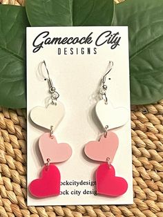 "FREE SHIPPING! HEART DANGLES Color Choices: shown in red, hot pink, white, and pastel pink, BUT you may choose from any of my acrylic colors (see last listing pic) *Made to order from 1/8\" cast acrylic *Laser cut *Hardware color choices: gold, silver, bronze (shown) *There is a post on the back of the heart if you choose that option. *Each heart is about 0.55\" tall Please take a look at my other shop listings. I also sell wooden and acrylic cut and engraved items, ornaments, and vinyl decals. Pink Earrings For Birthday And Valentine's Day, White Dangle Heart Earrings For Valentine's Day, Pink Hypoallergenic Earrings For Valentine's Day, White Heart-shaped Earrings For Birthday, White Heart Shaped Earrings For Birthday, Personalized Earrings For Valentine's Day, Heart Dangle Earrings For Valentine's Day Birthday, White Dangle Earrings For Valentine's Day, Earrings Hearts