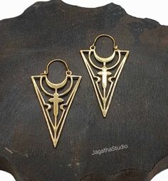 HANDMADE Beautiful handcrafted triangle cross ethnic boho earrings. Ideal for every day wear or for a special occasion. Aprox Length: 5.7 cm Aprox width: 3 cm Made with high quality jewelry brass nickel free. LINK Please follow the link to view my shop for other beautiful pieces. https://www.etsy.com/uk/shop/JagathaStudio Bohemian Geometric Gold Jewelry, Bohemian Ankh Shaped Jewelry For Festivals, Bohemian Ankh Jewelry For Festivals, Bohemian Brass Cross Jewelry, Bohemian Cross Jewelry For Festival, Bohemian Cross Shaped Brass Jewelry, Bohemian Style Brass Cross Jewelry, Bohemian Triangle Earrings With Ear Wire, Bohemian Ankh Nickel-free Jewelry