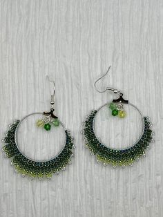 Handmade green ombre drop dangle hoop earrings sassy and fun would look great in any occasions. Dangle Hoop Earrings, Green Ombre, Ear Hook, Earrings For Women, In The Middle, Beaded Earrings, The Middle, Jewelry Earrings Dangle, Metallic Silver