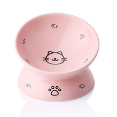 a pink bowl with a cat face on it