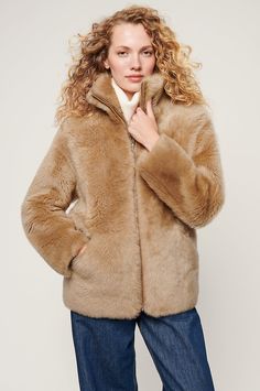 Make a statement in the fabulously stylish, wonderfully warm, and timelessly luxurious Adriana jacket. It's made from genuine Spanish Merinillo shearling with a lustrous texture and natural insulation, keeping you cozy from the earliest hint of winter to the last vestiges of spring. A standup collar gives edge to this zip-front coat, while two slip pockets offer space for chilly hands or small essentials. Luxury Faux Fur Outerwear In Mink Color, Luxury Mink Outerwear With Faux Fur Lining, Luxury Mink Outerwear With Faux Fur Trim, Luxury Sheepskin Fur Coat For Fall, Elegant Shearling Outerwear For Fall, Elegant Fall Shearling Outerwear, Elegant Shearling Outerwear In Mink Color, Elegant Mink Shearling Outerwear, Elegant Mink Colored Shearling Outerwear