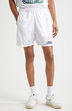 Serve your best style game on and off the court in these sporty tennis shorts equipped with side-seam pockets that hold three tennis balls each. This piece is part of a Nordstrom-exclusive capsule that pays tribute to two former tournament sites—Newport Casino and Forest Hills. Elastic waist Side-seam pockets 100% polyester Machine wash, line dry Made in Portugal Designer Clothing White Swim Trunks With Built-in Shorts, White Athletic Shorts With Built-in Shorts, Relaxed Fit, Tennis Athletic Shorts With Built-in Shorts, White Tennis Sportswear Bottoms, White Sporty Tennis Athletic Shorts, White Sporty Tennis Bottoms, Sporty White Tennis Bottoms, White Sportswear Tennis Bottoms, Sporty White Athletic Shorts For Tennis