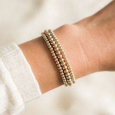 Our Stretch Bead Bracelet is the perfect balance between simple and bold. This bracelet is so versatile, so you can wear it casually lounging at home or dress it up and wear it to a fancy dinner party! Since it's a stretch bracelet, it's so comfortable that you'll never want to take it off (and you won't have to!). DETAILS 14k gold filled -or- sterling silver beads Bracelet length: 6.5". Please measure your wrist to see if this will fit, as we only have one size. It can stretch up to 6.75" comfo Minimal Gold Bracelet, Gold Ball Bracelet, Fancy Dinner Party, Minimal Bracelet, Stretchy Beaded Bracelet, Signature Bracelet, Sterling Silver Bead Bracelet, Take It Off, Silver Bead Bracelet