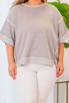 The Avoidant Top in sleet offers a versatile high-low hem and stylish contrast trim! Its drop shoulder design allows for comfortable wear, whether dressing up or down with denim or leggings! Elevate your wardrobe with this must-have piece! 46% Polyester, 39% Cotton, 15% Rayon Oversized Top With Striped Hem, Oversized Tops With Striped Hem For Spring, Fall Striped Hem Top For Loungewear, Oversized Spring Top With Striped Hem, Spring Oversized Top With Striped Hem, Oversized Striped Hem Tops For Spring, Crew Neck Tops With Striped Hem For Layering, Crew Neck Tops With Striped Hem, Casual Striped Hem Tops For Loungewear