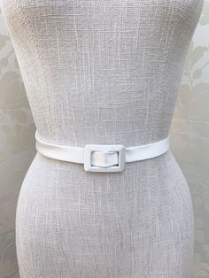 "This elegant simple bridal belt is beautifully hand made in 100% Silk Duchess satin. The belt features matching buckle in the front and it is secured with the velcro closure. It comes in many color choices, please see the last photo for the color reference only. This belt measures 3/4\" wide and the length is finished to your measurements. * Please include your waist measurements in the notes during checkout and your belt will be finished at that length - If you would like to order the swatches Bridal Sash Belt, Wedding Belt, Silk Satin Fabric, Wedding Sash Belt, Color Reference, Duchess Satin, Satin Sash, Wedding Belts, Bridal Sash