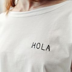 Hola Embroidery trendy T-Shirt Unique Design Limited Edition White Women's Trend T-Shirt Trend T-Shirt Unique, Hola, Embroidery Slogan Tshirt, Gift, Christmas, Birthday Gift, Mother's Day Gift, Valentine Gift HOLA Embroidered Minimal Slogan, Limited Edition, Designer White T-Shirt Loose T-shirt One Size %100 cotton Bottom: 56cm Length: 48cm Wash 30 degrees, No Tumble Dry, Iron Reverse White Embroidered Logo T-shirt For Summer, White Relaxed Fit T-shirt With Letter Embroidery, Summer T-shirt With Letter Embroidery And Short Sleeves, Summer Short Sleeve T-shirt With Letter Embroidery, Casual Summer T-shirt With Letter Embroidery, Graphic Tee With Letter Embroidery And Short Sleeves, White Casual Tops With Custom Embroidery, White Casual Top With Custom Embroidery, Summer Cotton Tops With Embroidered Logo