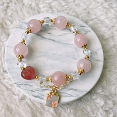 📝Material and Size Rose Quartz Beads: around 12mm Red Heart Bead is Strawberry Quartz 14k Gold Filled decoration beads Clear bead is Xilion Bicone (Also name as Swarovski crystal) Bracelet length: around 14cm 💜You will receive the exactly same bracelet as shown in the photo. 💜This handmade Jewelry listing come with an anti-oxidized jewelry box. 💜Please ensure you have no metal allergy before purchasing 💜Keep in mind these are natural stones and they may have small cracks and imperfections. Spiritual Beaded Bracelets For Valentine's Day, Pink Heart-shaped Spiritual Beaded Bracelets, Elegant Pink Beaded Heart Bracelet, Heart-shaped Bracelets With Faceted Beads For Gifts, Heart-shaped Bracelet With Faceted Beads For Gifts, Heart Shaped Bracelets With Faceted Beads For Gifts, Heart-shaped Faceted Beads Bracelet Gift, Pink Round Beads Jewelry For Valentine's Day, Rose Gold Bracelets With 8mm Beads For Gift