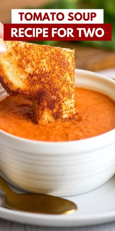 a bowl of tomato soup with grilled cheese on top and the words tomato soup recipe for two above it