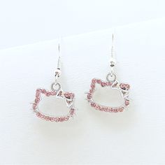 Earrings Hello Kitty Pink Crystal Silver Tone Bow Sanrio Cute Kawaii Cat Cartoon Anime Twee Softcore Kidcore Handmade With Love By Me. No Flaws, No Returns. Silver Tone And Crystal Rhinestone Charms On Hypoallergenic Earring Wires. [Earrings Hello Kitty Pink Crystal Silver Tone Bow Sanrio Cute Kawaii Cat Cartoon Anime Twee Softcore Kidcore Rhinestone Cubic Zirconia Cz] Kawaii Metal Jewelry, Trendy Silver Jewelry With Cat Design, Earrings Hello Kitty, Silver Dangle Kawaii Jewelry, Earrings Sanrio, Silver Dangle Earrings In Kawaii Style, Cheap Metal Hello Kitty Jewelry, Silver Hypoallergenic Kawaii Earrings, Silver Cat Ears Jewelry