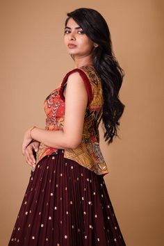 Maroon attached cancan lehenga with hand painted kalamkari border and embroidered glass beads. Paired with a padded peplum blouse with cream ajantha work, glass beads embroidery and pleat detailing on sleeves. - Aza Fashions Festive Unstitched Sleeveless Sets, Sleeveless Georgette Lehenga With Resham Embroidery, Reception Anarkali Sleeveless Sets, Unstitched Sleeveless Festive Set, Sleeveless Bollywood Sets With Resham Embroidery, Anarkali Sleeveless Designer Wear Sets, Bollywood Style Sleeveless Sets With Resham Embroidery, Sleeveless Anarkali Set For Designer Wear, Sleeveless Anarkali Designer Sets