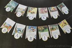 there is a banner made out of disney's books and baby names on it