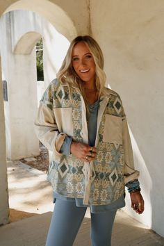 A true boho closet essential is the Tribal Blitz Jacket. This will become one of your go-to pieces to wear from season to season! Comfortable woven fabric with mix of solid corduroy and so cool print throughout Relaxed and loose jacket silhouette Classic collared neckline with a button-up front closure Loose long sleeves and convenient contrast front patch pockets Rounded bottom edge for added movement Perect boho layering piece! Pair with: Dora Low Back Seamless Bralette, On The Go V Neck Ribbe Boho Closet, Jacket Silhouette, Boho Essentials, Bralette Outfit, Loose Jacket, Boho Layering, Comfy Pants, Fall Collections, New Tops