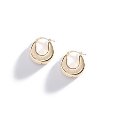 Add some retro flair to your ensemble with these 70s inspired puffy hollow hoops. Made of 14k gold with a mirror-like finish. Modern Hoop Earrings With Gold-tone Hardware, Retro Everyday Gold Jewelry, Retro Small Hoop Gold Jewelry, Retro Gold Round Hoop Earrings, Retro Gold Small Hoop Jewelry, Gold Retro Round Hoop Earrings, Modern Gold Hoop Earrings With Gold-tone Hardware, Retro Small Hoop Gold Earrings, Chic Gold Oval Hoop Earrings