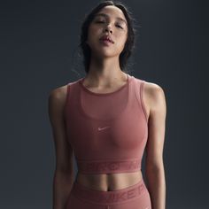 Don't be afraid to turn up the heat on your workout—this sweat-ready tank is made with mesh to help keep things breezy. The snug fit and elastic band at the hem help you feel secure through all your moves. Nike Compressive Nylon Activewear, Nike Nylon Yoga Activewear, Nike Nylon Activewear For Yoga, Nike Sweat Resistant Activewear For Yoga, Nike Sweat-resistant Activewear For Yoga, Nike Compressive Sweat Resistant Activewear, Nike Compression Activewear In Nylon, Nike Nylon Activewear For Workout, Nike Supportive Functional Activewear