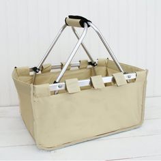 a large beige bag with two handles on the front and one handle attached to it