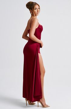 All eyes on you in Winona. the only design to dress you for every event this season. Crafted from our luxe stretch satin with a beautiful shine. this maxi hugs your figure for the silhouette of dreams. It's complete with a flattering cowl neckline. asymmetric detail to the body and a draped thigh high split to show a little bit of leg.   Colour: Burgundy. Premium stretch satin. Fully lined. Cowl neckline. Asymmetric pleats to body.  Drape detail thigh high split. Adjustable shoulder straps. Invisible zipper to back. Maxi length. Model is an XS and is wearing an XS. Homecoming Dresses Corset, White Dress Spring, Midi Dress Wedding Guest, Long Sleeve Homecoming Dresses, Homecoming Dresses Long, Maxi Dress Sale, Sparkle Dress, Cowl Neckline, Dresses By Length