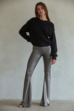 These babies are smooothhhh! Featuring a dark espresso base with deep chocolate-y metallic stripes, pull-on high waist, and stretchy body. These bell bottoms are SO flattering and make you have legs 👏🏻 for 👏🏻 days 👏🏻. Shelly is wearing size small. Black Stretch Shiny Bottoms, Black Shiny Stretch Bottoms, Stretch Shiny Black Bottoms, Sleek Stretch Shiny Pants, Sleek Metallic Bottoms, Fall Shiny Stretch Bottoms, Metallic Stretch Bottoms For Night Out, Shiny Stretch Bottoms For Fall, Glamorous Metallic Stretch Bottoms