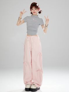 Elevate your kawaii wardrobe with these charming high-waist pink bowknots wide-leg cargo pants. The high waist design and adorable bowknot details add a touch of Lolita fashion to your look. Made with quality material, these wide-leg pants are comfortable and stylish, perfect for creating a sweet and elegant outfit.   Please note that this product includes only one pair of pants.   Garment Size   	 		 			Size 			S 			M 			L 			XL 		 		 			Full Length 			102 			104 			106 			108 		 		 			Waist Harajuku Style Wide Leg Bottoms For Spring, Pink Wide Leg Y2k Pants, Y2k Pink Wide Leg Pants, Pink Y2k Style Wide Leg Pants, Spring Pink Bottoms With Cargo Pockets, Trendy Pink Cargo Pants For Spring, Trendy Pink Wide Leg Parachute Pants, Trendy Pink Cargo Pants For Summer, Trendy Pink Baggy Wide Leg Pants