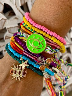 Bright and Joyful, Cheerful Arm Candy Bracelet Set - Weather resistant bracelet mix - Manually knotted - Weightless and soundless - Fits most, small to large wrists Included: - Elastic Seed Beads Colorful Bracelets - Set of 5 - Wire adjustable bracelets or Hilitos Colored & Neon Mix, set of 3 or 5 depending on model - Sets varies upon selection, some includes randomly selected charms, focus piece and manually sewed words Bohemian Adjustable Stretch Bracelet For Party, Bohemian Multicolor Wrap Bracelet With Sliding Knot, Adjustable Beaded Bracelets With Charms For Beach, Trendy Multicolor Friendship Bracelets With Sliding Knot, Colorful Adjustable Bracelets For Festival, Adjustable Charm Bracelet With Round Beads For Festivals, Multicolor Wrap Bracelet With Sliding Knot For Gift, Multicolor Wrap Bracelet With Sliding Knot As Gift, Multicolor Wrap Bracelet With Sliding Knot