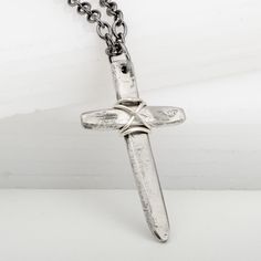 This Medieval Cross Wired Pendant Necklace is perfect for any occasion. Made from 925 sterling silver, it's hand-hammered and wound with silver wire for a beautiful, patina-inspired rustic look. Great for Father's Day, First Communion, or Confirmation, this necklace is the perfect gift to share the bond of love and faith between father and son. Antique Silver Hand Forged Sterling Silver Necklaces, Medieval Hand Forged Sterling Silver Jewelry, Hand Forged Antique Silver Sterling Necklace, Hand Forged Sterling Silver Necklace In Antique Silver, Hand Forged Silver Medieval Jewelry, Hand Forged Medieval Silver Jewelry, Medieval Silver Cross Pendant Jewelry, Antique Silver Medieval Jewelry With Oxidized Finish, Medieval Sterling Silver Nickel-free Jewelry