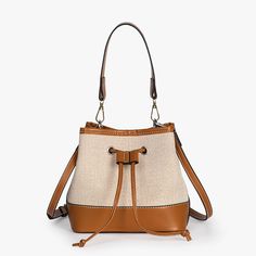 The Vintage Canvas Bucket Bag is a timeless classic made for everyday use.Made from our Premium Vegan Leather trim and canvas, it is durable and very light weight. It opens up to a roomy interior that will can easily fit all your everyday essentials. Comes with a short strap to carry as a handbag and long strap to sling. Giving you endless styling options. Perfect for work, travel or even just a casual day out.Details• 100% Vegan Leather• Lightweight Canvas• 7.8“W x 4.7“D x 7.8“H (20cm x 12cm x Canvas Bucket Bag, Lighted Canvas, Backpack Tote Bag, Vintage Canvas, Work Travel, Tote Backpack, Timeless Classic, Bag Straps, Leather Trims