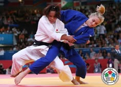 two women compete in a karate match