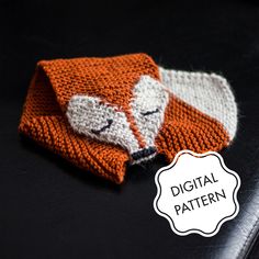 an orange and white knitted hat with a fox on it's side next to the words digital pattern