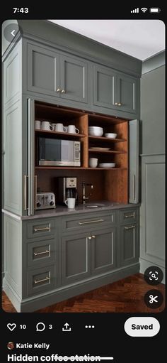 the kitchen cabinets are painted gray with gold trim