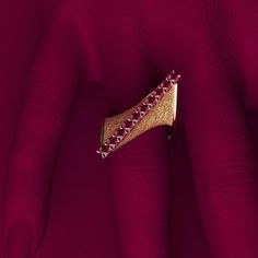 Discover the elegance of Italian craftsmanship with our Modern Twisted Gold Ring, featuring a sophisticated design and exquisite attention to detail. Created by Oltremare Gioielli, this luxurious ring showcases a beautifully crafted twist with polished edges and earth-textured surfaces, embodying both modern style and timeless elegance. The top ridge is adorned with 10 round, natural rubies (2.8mm each, approximately 0.82 carats), adding a touch of vibrant color and brilliance. Handcrafted in It Twisted Gold Ring, Jeweled Earrings, Italian Craftsmanship, Ring Pendant Necklace, Sophisticated Design, Engagement Ring Wedding Band, Natural Ruby, Men's Rings, Pendant Bracelet