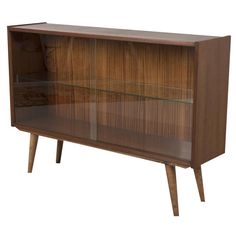 a wooden cabinet with glass doors and legs