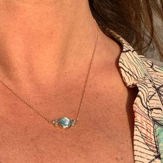 A beautiful blue Aquamarine is flanked by a trio of brilliant cut and rose cut diamonds. Set in a 14k gold bezel with 14k gold cable chain this is truly a spectacular piece. Centerpiece measures approx 18mm x 11mm Center stone : 9mm x 9mm Center ct weight: 2.7ct 14k Chain hangs 17" with lobster clasp. This one of a kind piece is handmade with love in Emily's Hudson Valley studio. If you have questions about sizing, shipping or need help deciding please reach out to us! Bubble Necklaces, Aquamarine Necklace, Aquamarine Blue, Rose Cut Diamond, Hudson Valley, Rose Cut, Cable Chain, Handmade With Love, Beautiful Blue